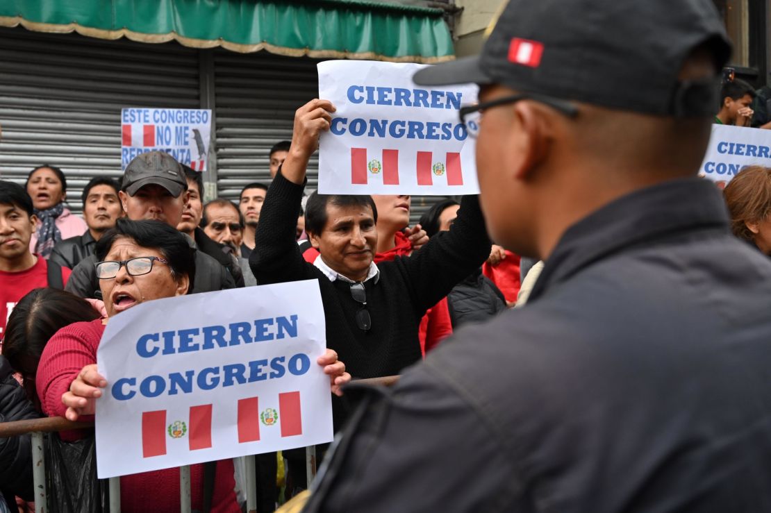 Protesters demand the dissolution of the congress and demonstrate against lawmakers in Lima on September 30, 2019.