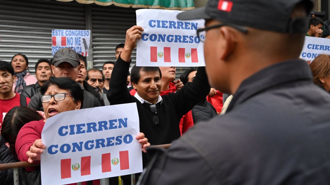 Protesters demand the dissolution of the congress and demonstrate against lawmakers in Lima on September 30, 2019.
