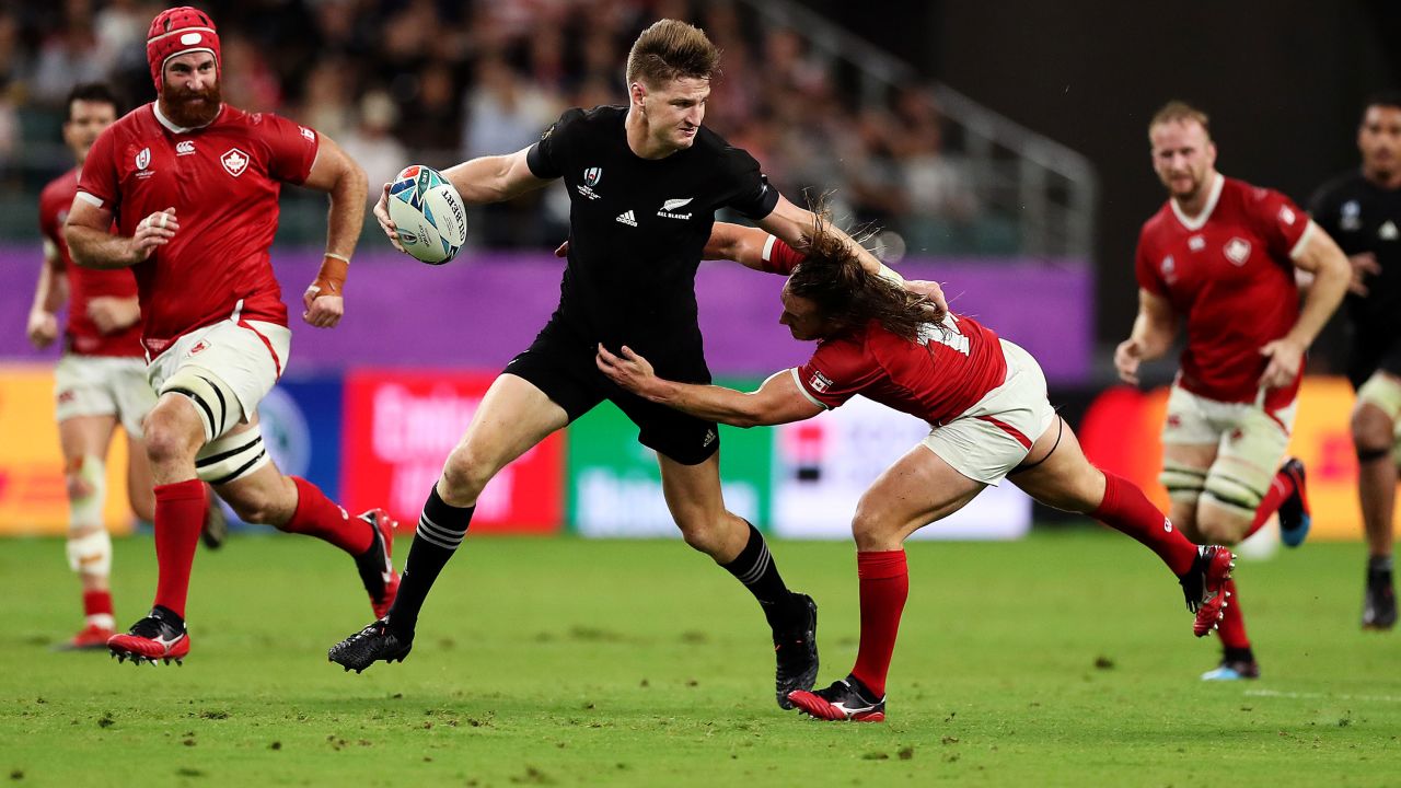 Jordie Barrett shrugs off an attempted tackle from a despairing Canadian player during the All Blacks' 63-0 romp over the North American team. 