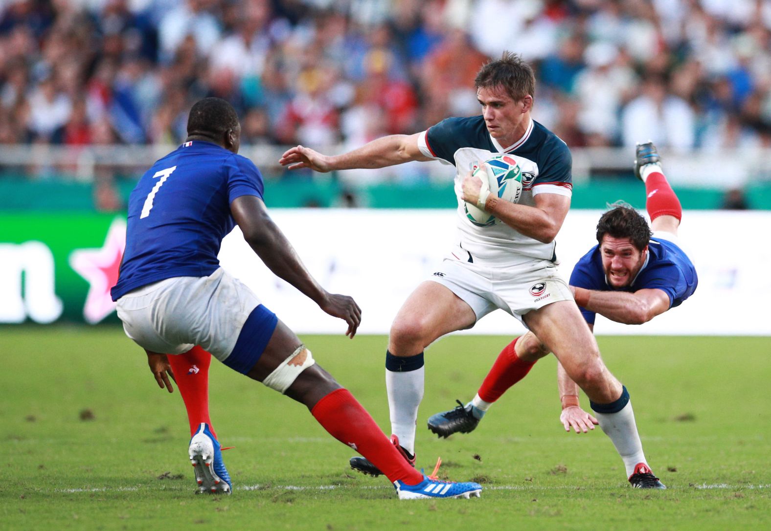 AJ MacGinty (middle) scored all nine points for the USA with his boot, going three for three with his penalties. 