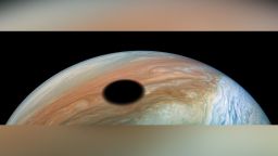 Jupiter's volcanically active moon Io casts its shadow on the planet in a galactic solar eclipse. 