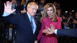 MANCHESTER, ENGLAND - OCTOBER 02: Prime Minister Boris Johnson exits the hall with his girlfriend Carrie Symonds following his keynote speech on day four of the 2019 Conservative Party Conference at Manchester Central on October 2, 2019 in Manchester, England. The U.K. government prepares to formally submit its finalised Brexit plan to the EU today. The offer replaces the Northern Irish Backstop with border, customs and regulatory checks lasting until 2025. (Photo by Jeremy Selwyn - WPA Pool /Getty Images)