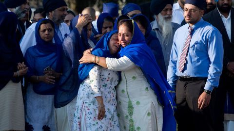 Relatives of Dhaliwal and other mourners arrive at Berry Center for Wednesday's services.