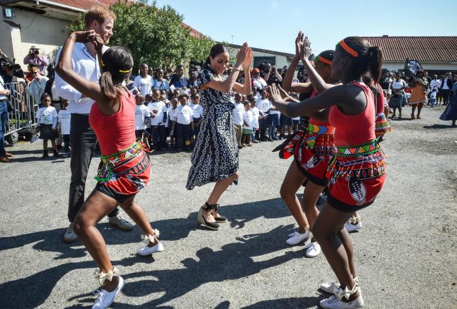 The Duchess of Sussex kicked the royal tour off by wearing a black and white wraparound dress from Myamiko, a Malawi fair-trade brand, during a visit to the Justice Desk, an NGO in Nyanga in Cape Town.