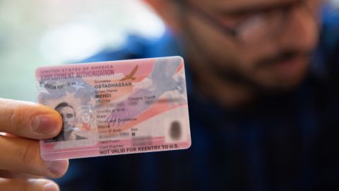 Ostadhassan shows his US work permit, which expires this month.