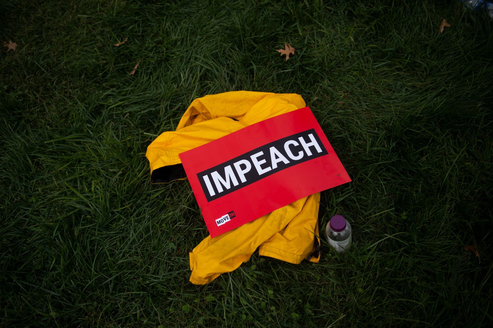 An "impeach" sign is seen on the grass during a rally in Washington on September 26.