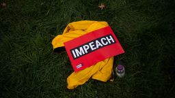 A sign reading "impeach" is seen on the grass during the "People's Rally for Impeachment" on Capitol Hill in Washington, DC on September 26, 2019. - Top US Democrat Nancy Pelosi announced on September 24 the opening of a formal impeachment inquiry into President Donald Trump, saying he betrayed his oath of office by seeking help from a foreign power to hurt his Democratic rival Joe Biden. (Photo by ANDREW CABALLERO-REYNOLDS / AFP)        (Photo credit should read ANDREW CABALLERO-REYNOLDS/AFP/Getty Images)