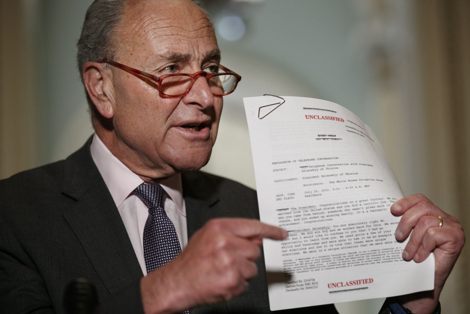 Senate Minority Leader Chuck Schumer holds a copy of the phone-call transcript that was released by the White House on September 25. <a href="index.php?page=&url=https%3A%2F%2Fwww.cnn.com%2Fpolitics%2Flive-news%2Ftrump-impeachment-inquiry-09-25-2019%2Fh_be0392c4d6e5bc0069690ae4c794ad63" target="_blank">The Democratic leader said</a> the transcript "validates the wisdom" of Pelosi to announce an official impeachment inquiry.