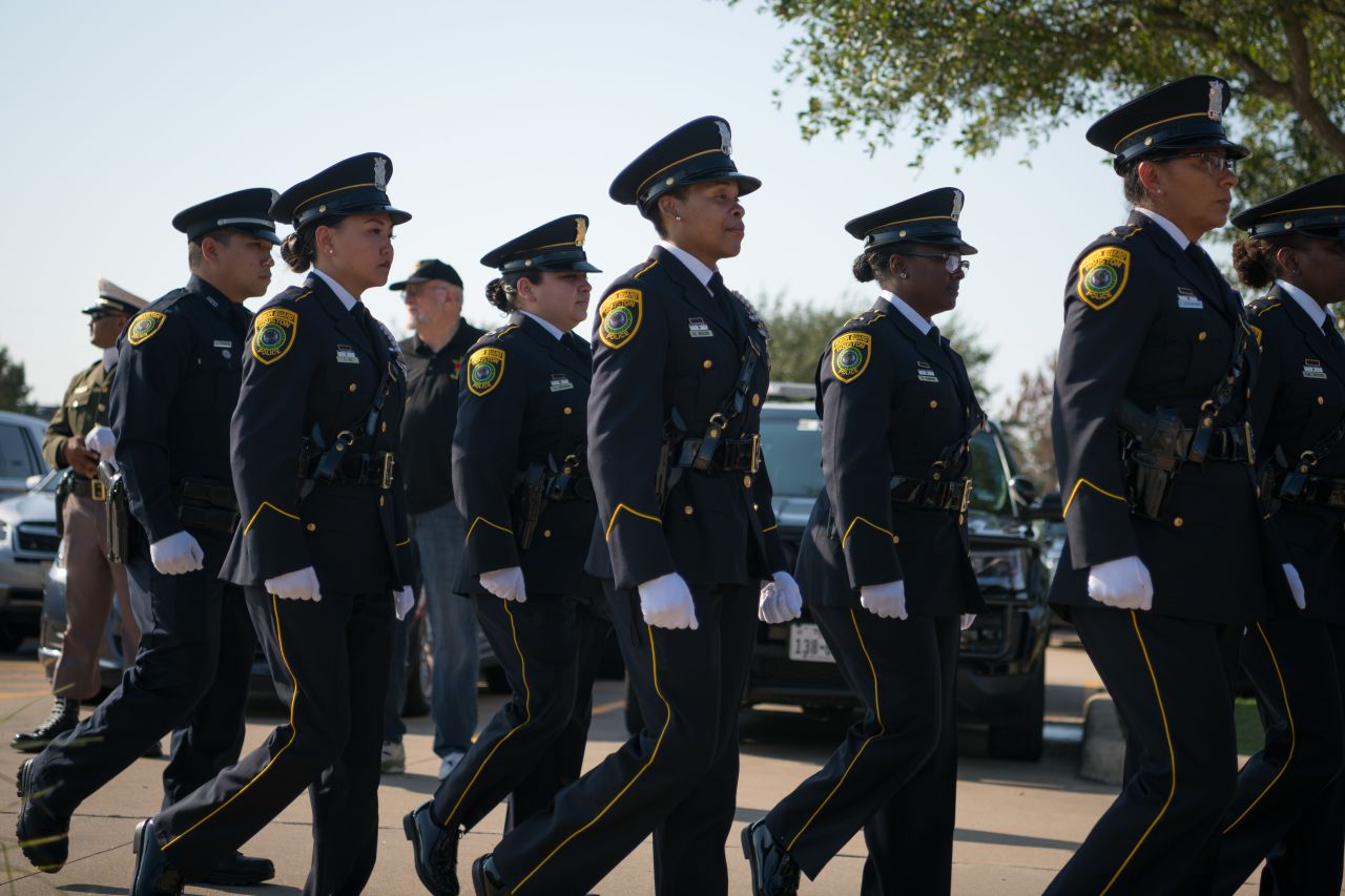 Houston Police Department Honor Guard members arrive at the Berry Center.