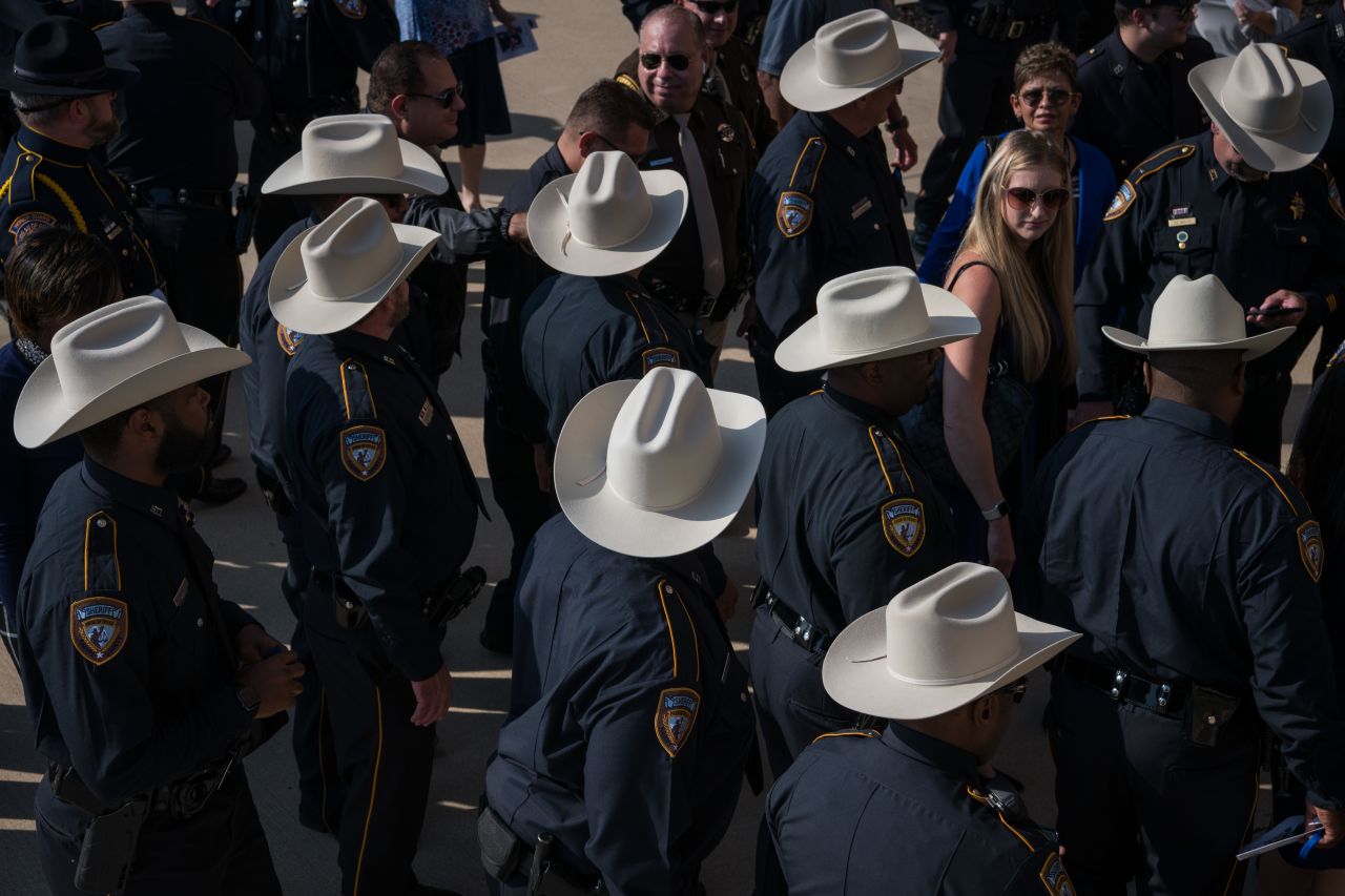 Harris County Sheriff's Office personnel arrive for funeral services.