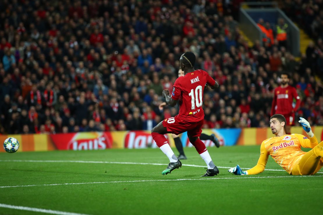 Sadio Mane of Liverpool opens the scoring at Anfield.
