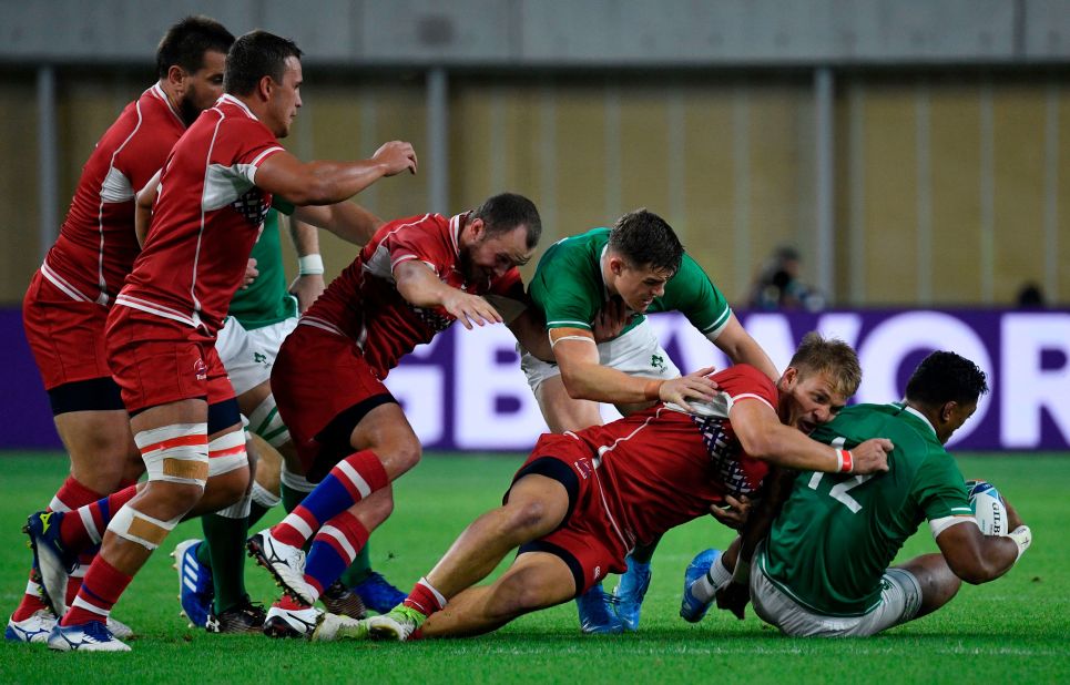 Ireland's centre Bundee Aki (right) felt the force of Russian opposite number Kirill Golosnitskiy during the Pool A match.