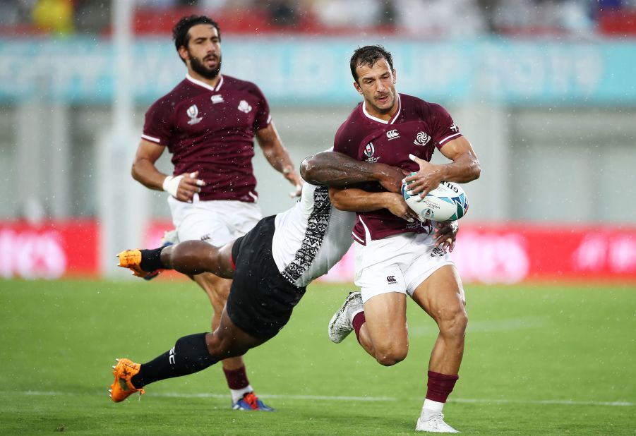 Georgia's Soso Matiashvili is shackled during the game against Fiji.