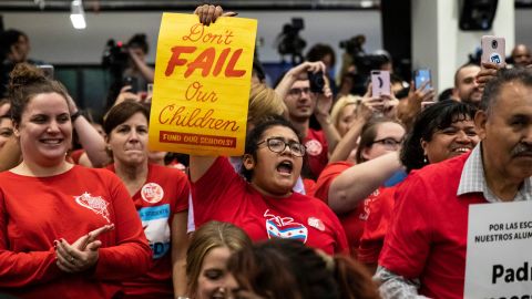 Supporters cheer at the Chicago Teachers Union headquarters in Chicago on September 24.  