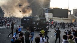 Protesters clash with Iraqi riot police during a demonstration against state corruption and poor services, between Baghdad's Tahrir Square and the high-security Green Zone district, on October 1.