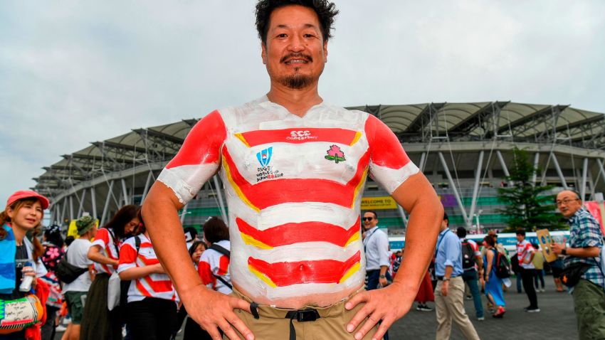 A Japan fan has the national team's jersey painted on as he arrives for the Japan 2019 Rugby World Cup Pool A match between Japan and Ireland at the Shizuoka Stadium Ecopa in Shizuoka on September 28, 2019. (Photo by William WEST / AFP)        (Photo credit should read WILLIAM WEST/AFP/Getty Images)