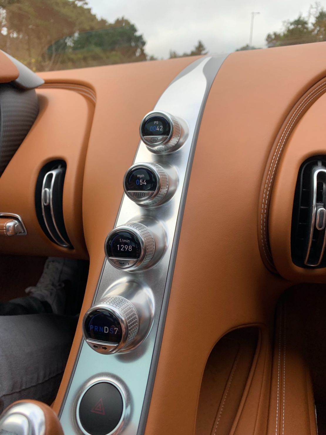 Rather than a large screen, the Chiron has discrete computer displays nested inside knobs.