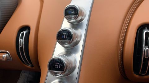 Rather than a large screen, the Chiron has discrete computer displays nested inside knobs.