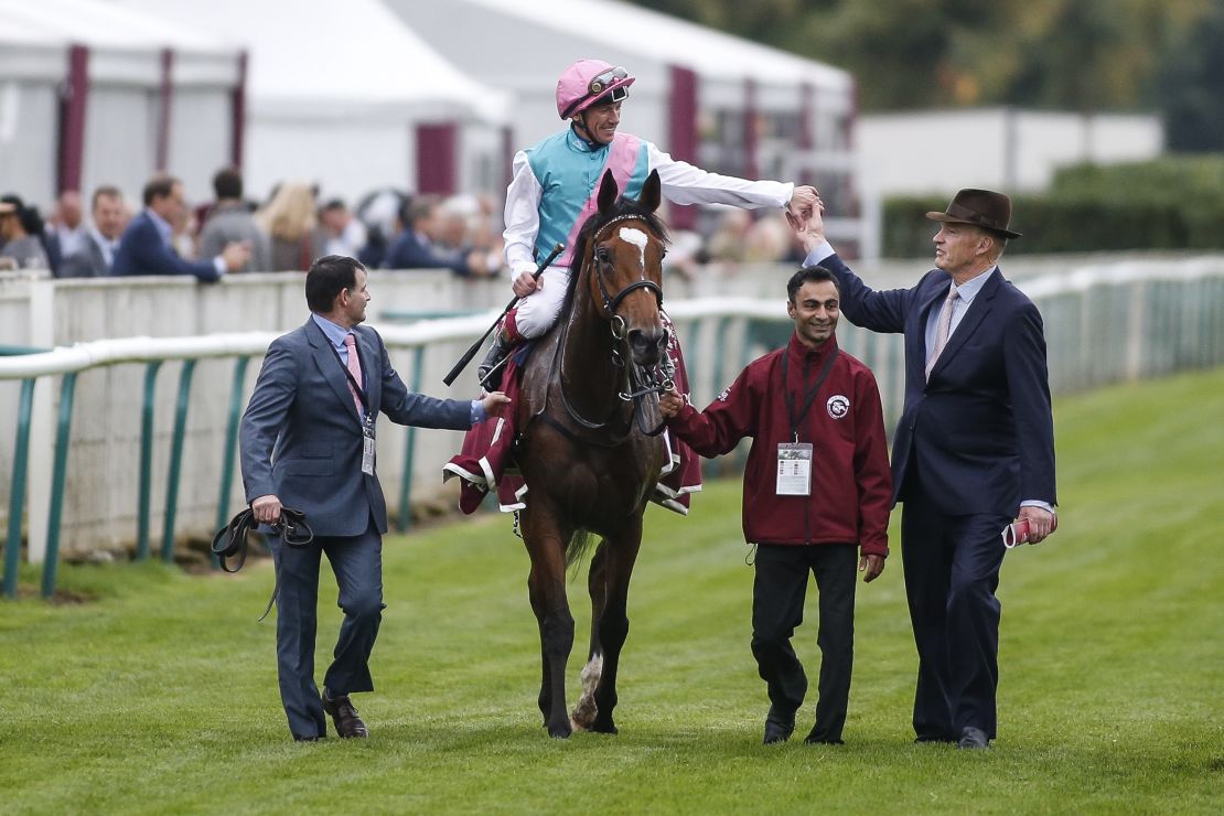 Imran Shawani (second from right) has worked for trainer John Gosden (right) for 14 years.