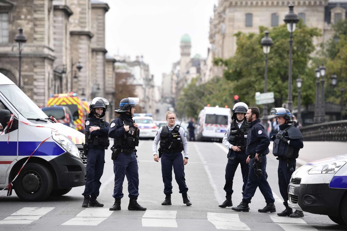 Police block the street after the knife attack. 