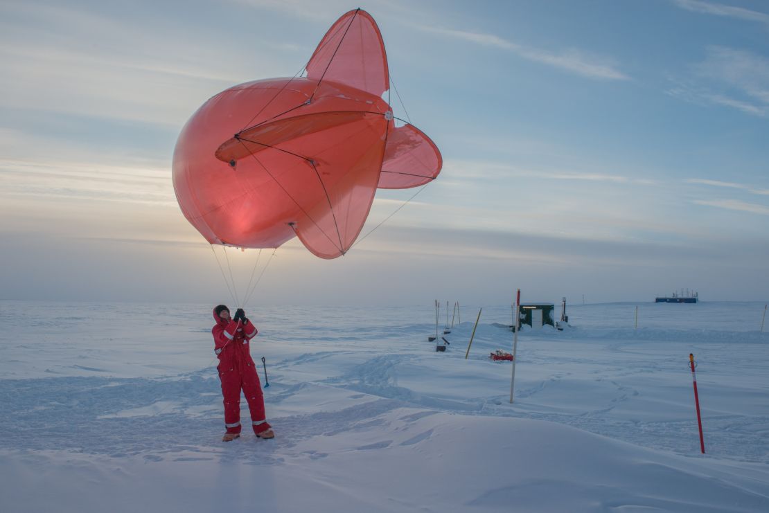 A Leibniz Institute for Tropospheric Research team member operating a helium-filled balloon in Greenland, 2018. Horvath followed the years of preparations which led to the MOSAiC expedition finally departing in September 2019.