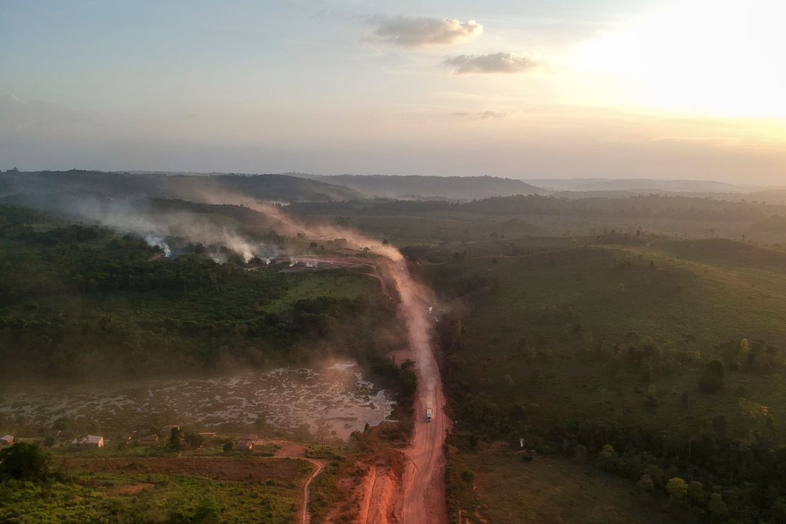 Red road dust mixes with fire smoke in the town of Ruropolis, Para State, Brazil, on September 6, 2019.