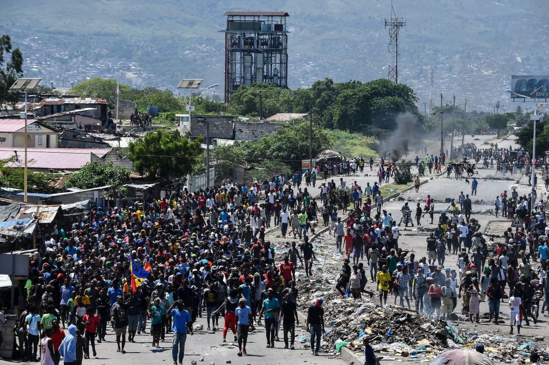 People march in Cite Soleil during the anti-government protest on September 27, 2019. 
