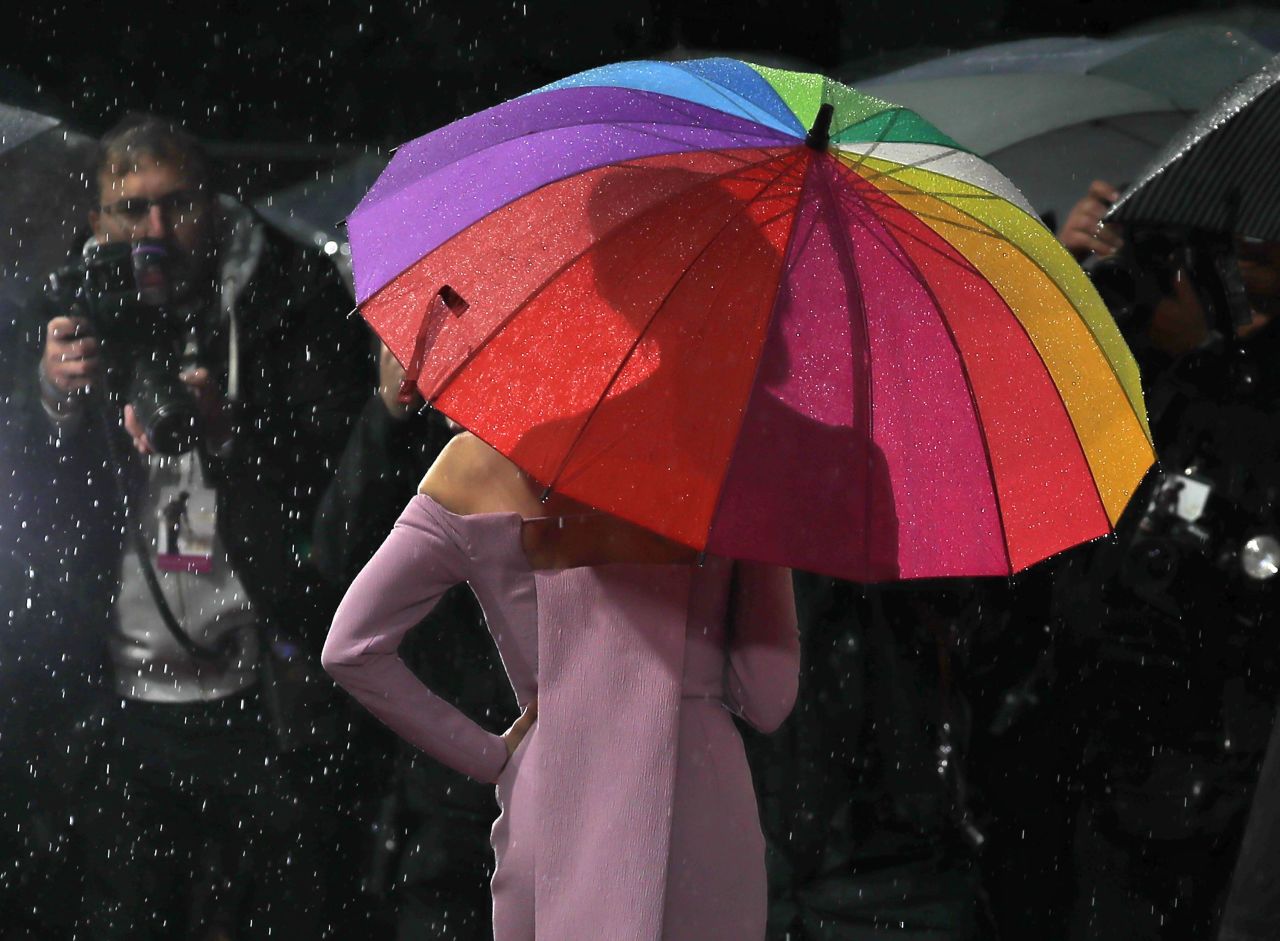 Actress Renee Zellweger poses under a rainbow umbrella at the London premiere of the film "Judy" on Monday, September 30. Zellweger portrays actress Judy Garland in the new movie.