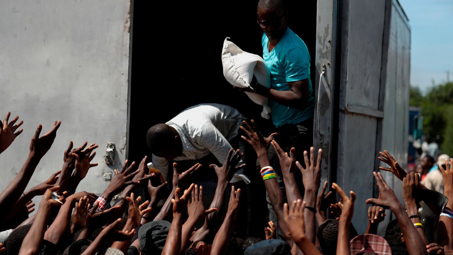 Food and school supplies are delivered to a Port-au-Prince neighborhood