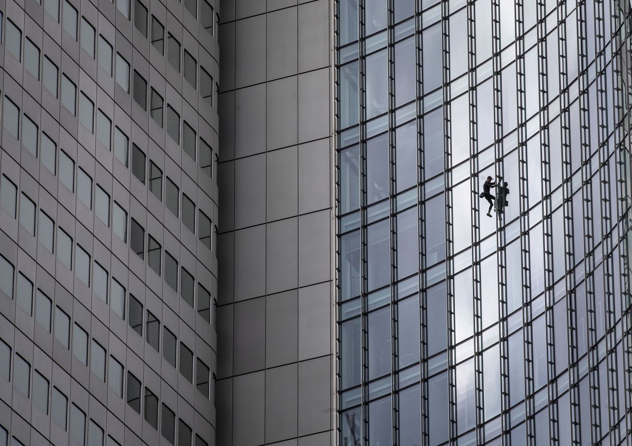 Daredevil climber Alain Robert, dubbed the French Spiderman, climbs down the Skyper high-rise in Frankfurt, Germany, on Saturday, September 28.