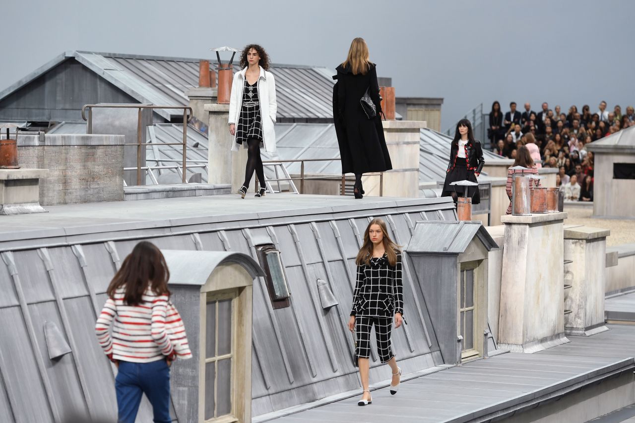 Models wear Chanel during a fashion show at the Grand Palais in Paris on Tuesday, October 1.