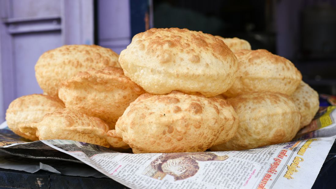 <strong>Luchi, Bangladesh. </strong>This golden flatbread is a popular choice for breakfast in Bangladesh, but you can also find the puffy breads at Dhaka sidewalk stalls and home kitchens.<br />
