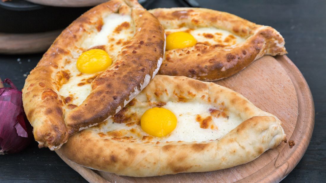 <strong>Khachapuri, Georgia.</strong> This savory flatbread starts with dough that's pinched into a boat-shaped cradle and baked with a generous filling of egg and cheese.