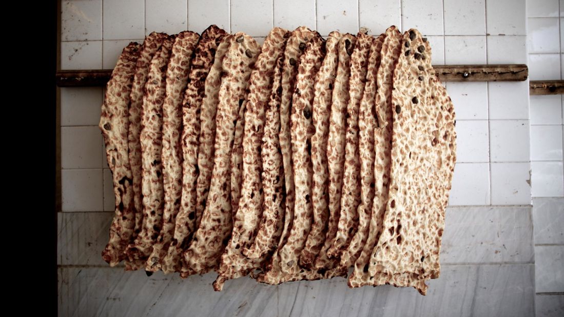 <strong>Sangak, Iran.</strong> Eat this flatbread, also called nan-e sangak, on its own, or turn it into an Iranian-style breakfast. Use a piece of sangak to wrap salty cheese and a bundle of aromatic green herbs.