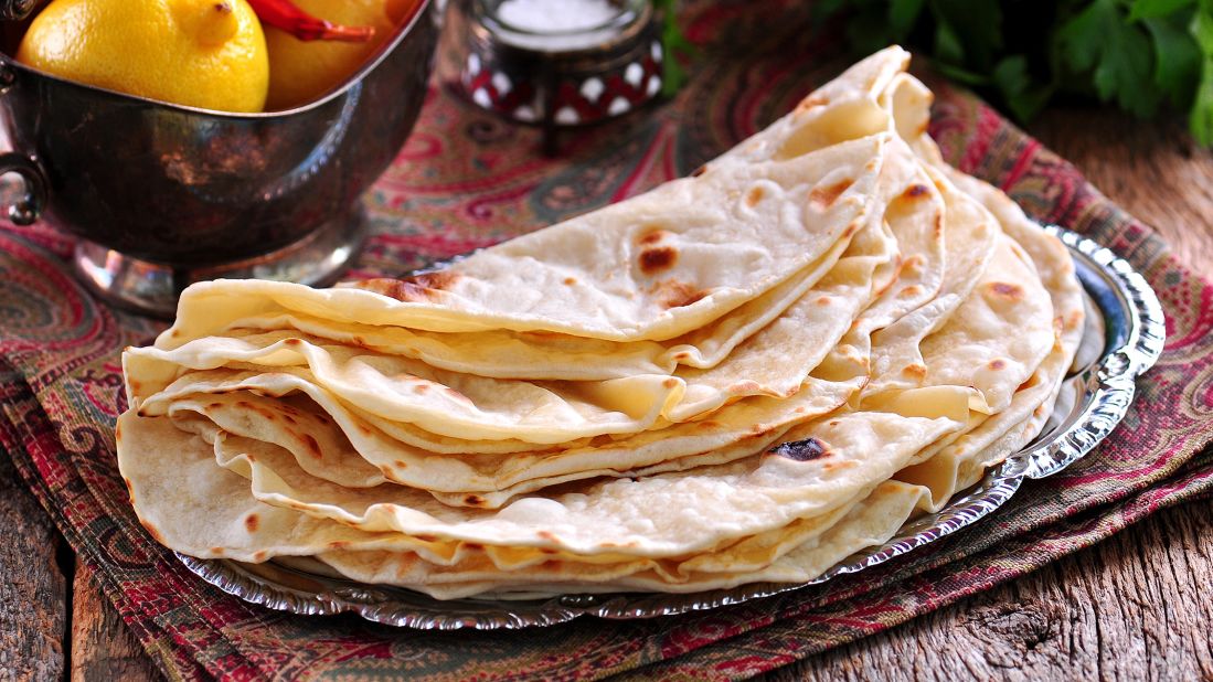 <strong>Taboon bread, Jordan.</strong> Bakers in roadside stalls in the capital city of Amman make and stack this classic flatbread into steaming piles. 