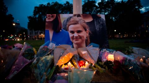 Flowers surround a picture of Jo Cox during a vigil in Parliament Square on June 16, 2016 in London. Cox was murdered in her electoral district in 2016.   
