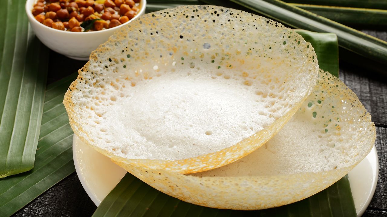 <strong>Appam, Sri Lanka. </strong>A thin, fermented batter of rice flour and coconut milk turns crisp in the bowl-shaped pans used for cooking appam, one of Sri Lanka's most ubiquitous treats. 