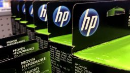 This Aug. 15, 2019, photo shows the HP logo on Hewlett-Packard printer ink cartridges at a store in Manchester, N.H.  Hewlett-Packard  reports financial results Thursday, Aug. 22. (AP Photo/Charles Krupa)