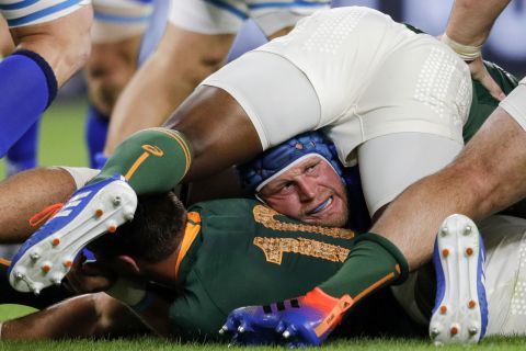 Italy's hooker Luca Bigi is caught at the bottom of a ruck.