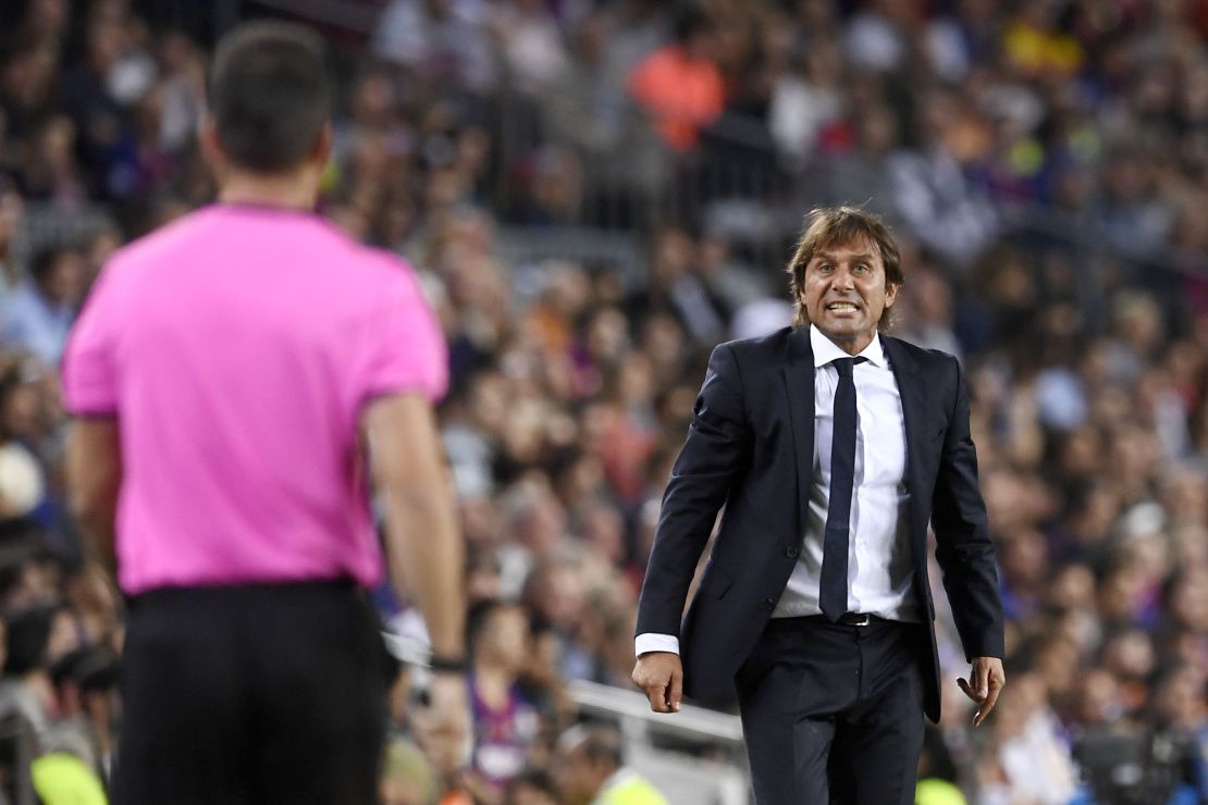 Inter Milan coach Antonio Conte protests to an officialduring the 2-1 defeat at Barcelona.