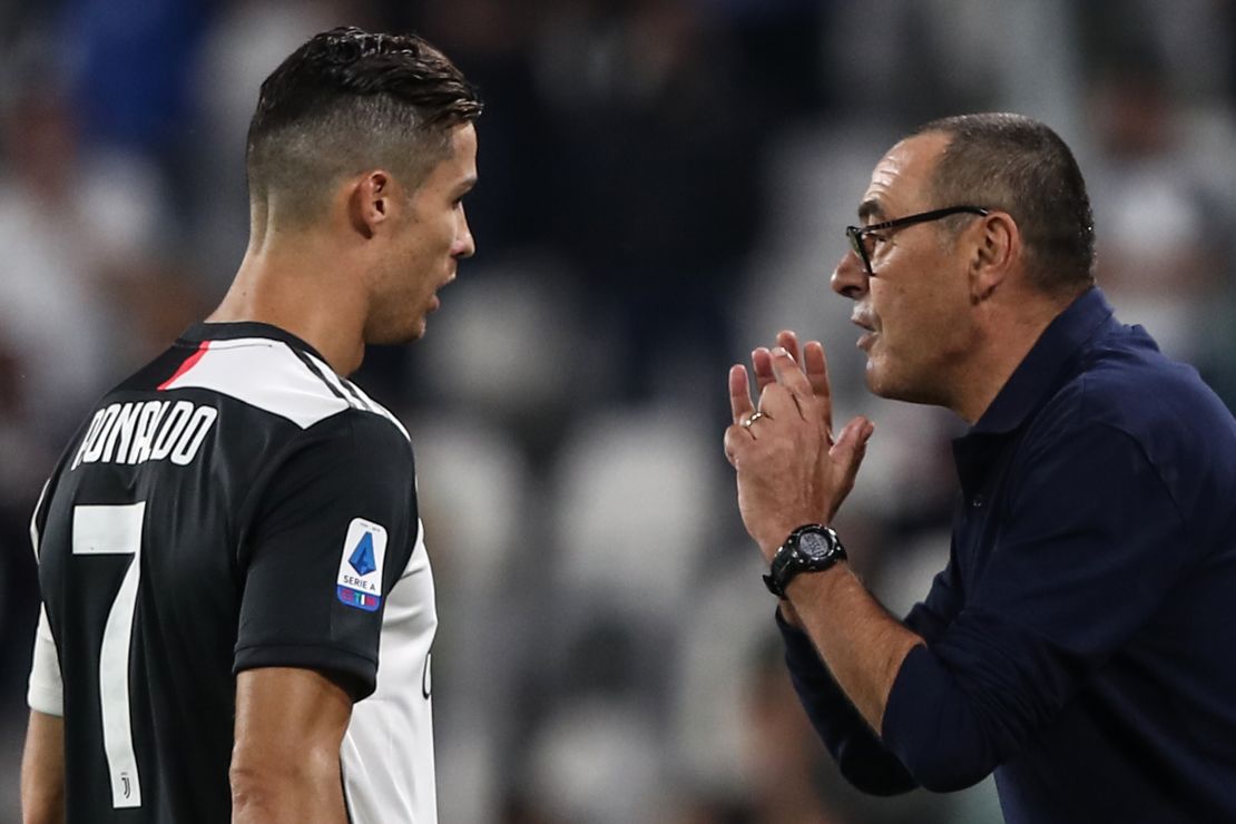 Juventus' Italian coach Maurizio Sarri (R) gives instructions to Juventus' Portuguese forward Cristiano Ronaldo during the  match Juventus vs Verona on September 21.