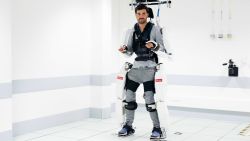 Paralyzed man moves using mind reading robotic suit
