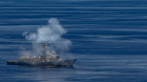 The former USS Ford, a decommissioned frigate, sustains damage as U.S. Navy ships, aircraft and a submarine and Republic of Singapore ships fire at it during a sinking exercise off Guam on Tuesday.