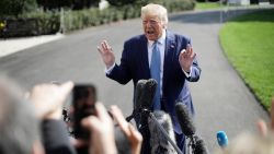 President Donald Trump speaks to the media on the South Lawn of the White House in Washington, Friday, October 4, 2019, before his departure to nearby Walter Reed National Military Medical Center in Bethesda, Maryland.