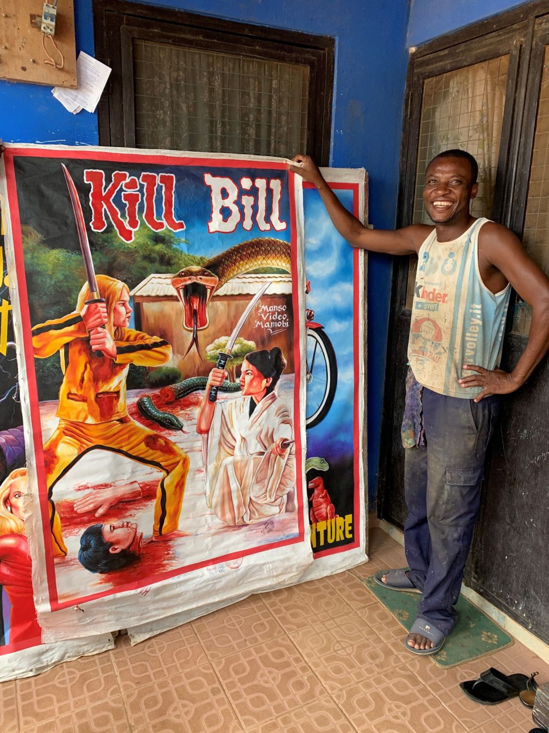 Artist Heavy Jay poses  with a poster for "Kill Bill."