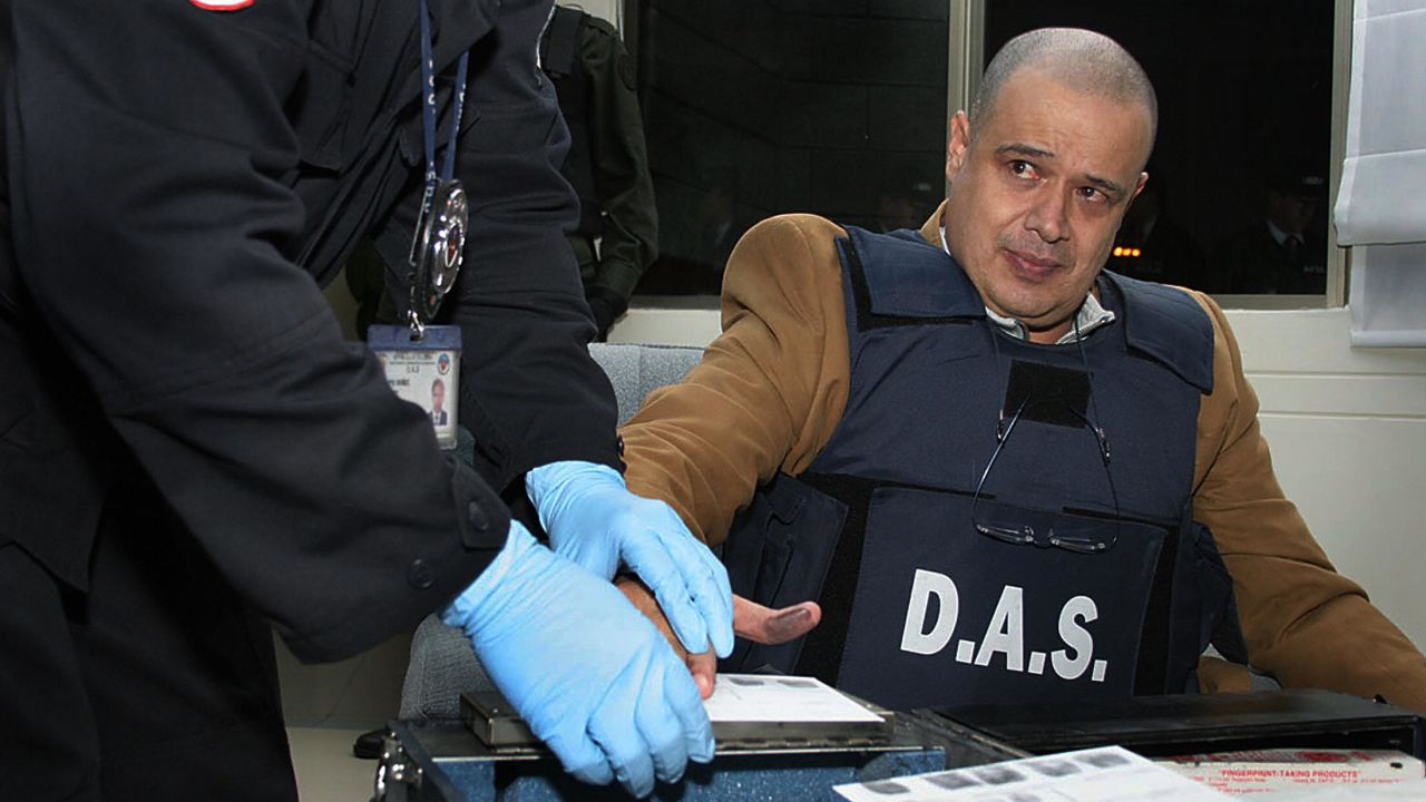 Luis Hernando Gomez Bustamante (right) is one of the men Klapper helped apprehend for his connection to the Norte Valle drug cartel. Here, he is registered by police in Bogota, Colombia in 2007 after being deported from Cuba.