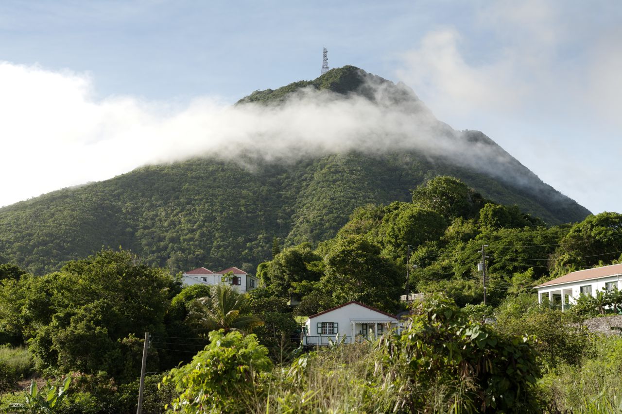 The peak of an extinct volcano, Mount Scenery, is the island's highest point.