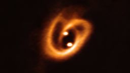 The Atacama Large Millimeter/submillimeter Array (ALMA) captured this unprecedented image of two circumstellar disks, in which baby stars are growing, feeding with material from their surrounding birth disk. The complex network of dust structures distributed in spiral shapes remind of the loops of a pretzel. These observations shed new light on the earliest phases of the lives of stars and help astronomers determine the conditions in which binary stars are born.