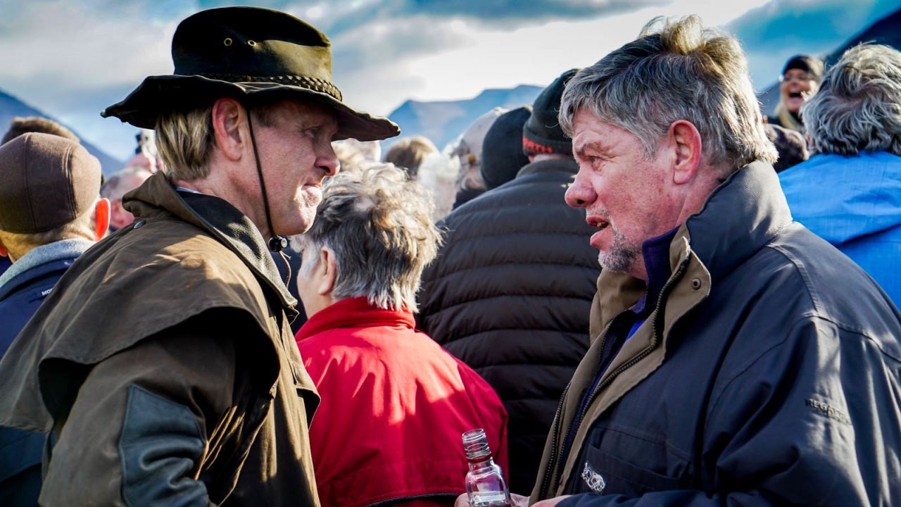 <strong>Horse talk: </strong>Two Icelandic farmers enjoy a catch up over a bottle of warming Icelandic liquor.