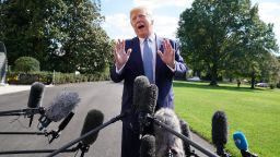 US President Donald Trump talks to journalists on October 4, 2019, on the South Lawn of the White House before boarding Marine One and traveling to Walter Reed National Military Medical Center October 04, 2019 in Washington, DC.